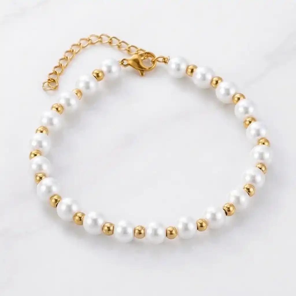 Pulseras en perlas blancas para dama con cadena en acero inoxidable y baño de oro 18k