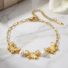 Pulseras para mujer de moda con fina cadena delgada con detalles de mariposas ornamentales y pequeñas perlas blancas decorativas con baño de oro 18k de acero inoxidable