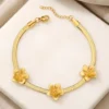 Pulseras para damas estilo flexible tipo malla con apliques de flores de acero y bañada en oro 18k